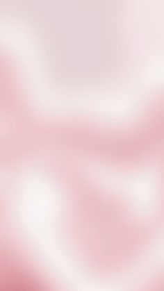 a blurry pink and white background is shown in this image, it appears to be very soft