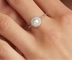 "𝐃𝐞𝐬𝐜𝐫𝐢𝐩𝐭𝐢𝐨𝐧 : *Freshwater Pearl Ring, Pearl With Round Cut CZ Stone Halo Ring, 14K Gold Sea Pearl Engagement Ring, Minimalist Ring, Daily Wear Classic Ring. ❖ 𝐃𝐢𝐚𝐦𝐨𝐧𝐝 𝐃𝐞𝐭𝐚𝐢𝐥𝐬 *Color : White *Clarity : VVS *Cut : Excellent *Center Stone Shape : Pearl *Center Stone Size : 5.00 MM *Side Stone Size : 1.10, 1.30 MM *Side Stone Weight : 0.24 CT *Type : Cubic Zirconia (CZ) / Pearl *We have all types of fancy & color Gemstone. For more queries please contact us immediately. ❖ 𝐑𝐢𝐧𝐠 𝐃𝐞𝐭𝐚𝐢𝐥𝐬 *Metal Purity : Solid Gold (10K, 14K, 18K); 925 Sterling Silver *Stamp : Yes (As per metal purity) *SKU : SR16118 *Making Process : Handmade > Crafted by our experienced craftsman. ❖ 𝐂𝐮𝐬𝐭𝐨𝐦𝐢𝐳𝐚𝐭𝐢𝐨𝐧 *Buyer can Request change of rhodium color in 925 Silver Jewelry (N Engagement Ring With Pearls And Diamonds, Pearl Halo Engagement Ring, Ring Daily Wear, Engagement Ring Minimalist, Pearl Wedding Ring, Dainty Jewellery, Pearl Engagement Ring, Ring Pearl, Future Engagement Rings