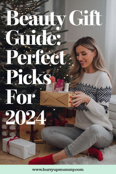 A woman sitting by a Christmas tree holding a wrapped gift box filled with beauty products, perfect for a Christmas gift guide. Viral Skincare Products, Perfect Beauty