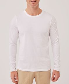 Men's White Softspun Long Sleeve Tee L. Super soft organic men's Softspun Long Sleeve Tee from Wear PACT. Fair Trade Factory. GOTS Certified Organic Cotton Fitted Cotton Long Sleeve Top, Fitted Cotton Shirt For Loungewear, Basic Cotton Long Sleeve Top For Spring, Basic Tops For Casual Gatherings, Spring Cotton Crew Neck Long Sleeve Top, Basic Cotton Long Sleeve Top For Loungewear, Fitted White Tops For Casual, Cotton Tops With Shirttail Hem For Fall, White Fitted Top For Casual Gatherings