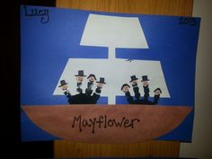 a paper cut out of three men in top hats on a boat with the word mayflower