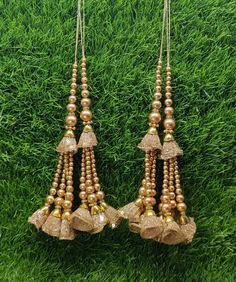 Indian Handmade Gold Latkan for Saree Blouse Lehenga HandBags Dupatta Decoration Bridal Wedding dress for Women pair of 2 pcs Size - 19.0 cm Length  Item Description You can use this Beautiful pair of tassle for several DIY projects.  *These beautiful Tassel Latkans are used as the accessory for saree blouse on the back, but u can use according to your need and your innovative ideas. * Package contains 2 Latkan / 1 Pair Other Than Saree Blouse, you can use these latkans in various ways Craft Projects Designing Home Decoration Festive celebrations. Evening and party Apparels. Home décor items Apparel & Fashion Scarves n Stoles Headband, hats Table cover, curtains, Pillow covers, Cushion cover Shoe designing Headband, hats Table cover, curtains Designing stylish blouses Ship From New Delhi, Gold Lehenga With Dori Work For Puja, Festive Wedding Choli With Latkans, Diwali Party Sets With Latkans, Party Sets With Latkans For Diwali, Wedding Choli With Latkans For Diwali, Wedding And Festival Sets With Latkans, Festival Wedding Sets With Latkans, Wedding Sets With Latkans For Festivals, Diwali Party Choli With Latkans