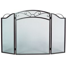 an iron fireplace screen with glass panels