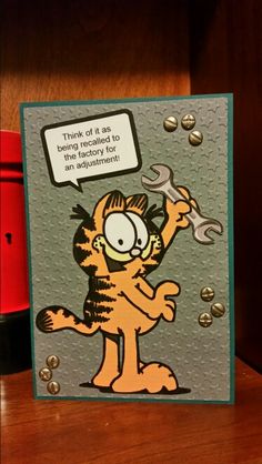 a card with a cartoon cat holding a wrench