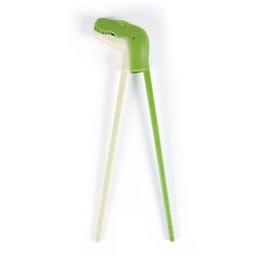 a green and white toothbrush on a white background