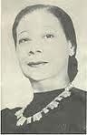 an old black and white photo of a woman wearing a necklace with words on it