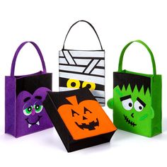 three halloween bags with faces on them