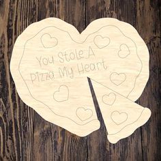 a wooden heart with the words you stole a pizza my heart on it and two slices cut out