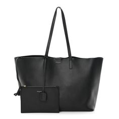 This is an authentic SAINT LAURENT Calfskin Large Shopping Tote in Black. This chic tote is crafted of supple calfskin leather in black. The shoulder bag features long strap handles attached to a wide-open top, revealing a black suede leather interior with a matching removable pouch. Shopping Tote, Open Top, Leather Interior, Black Suede, Suede Leather, Calf Skin, Saint Laurent, Handles, Pouch