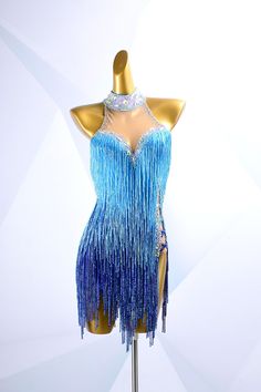 a mannequin dressed in blue and silver fringes