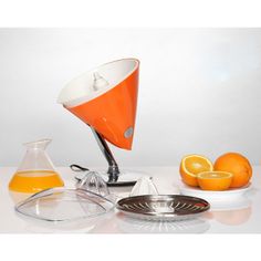 an orange juicer is sitting on a table