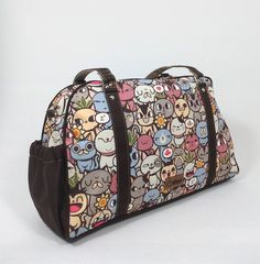 "Ideal for all cat lovers, super cute   fashion traveler shoulder bag with zipper closure, handles, detachable shoulder strap,  two outside pockets (one with zipper closure), and three internal pockets. It is a great handbag for everyday use.   Perfect for all your travel necessities, including makeup, wallet, coins, keys, computer, work items, calculator, and all your extra things.  Waterproof, lightweight, and fashionable.  Size: 5.25\" (length) x 17\" (width) x 11\" (height) Inches. ⭐ Character - All Cats 🐱: All cats is a design that shows 30 different cats. In this catopia you can find all types of cats, from fluffy grumpy grandpa to playful kittens. The cat ambassador of All Cats is Samuel, our troublemaker. He loves games, music, movies and food - He definitely loves food-, but more Cute Travel Tote Satchel, Cute Travel Shoulder Bag With Zipper Closure, Travel Shoulder Bag With Cat Print, Cute Shoulder Bag With Zipper Closure For Travel, Cute Shoulder Bag With Zipper For Everyday Use, Cute Cat Print Travel Bags, Cat Design Shoulder Satchel, Cat Design Satchel Shoulder Bag, Cat Design Satchel Bag For Everyday Use