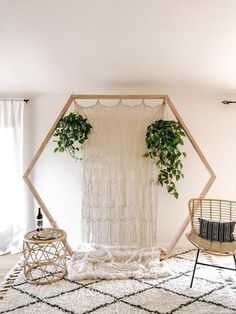 a living room with plants and rugs on the floor