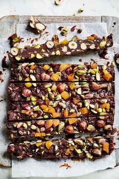 chocolate barkle with nuts and pistachios on parchment paper, ready to be eaten