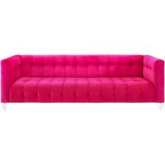 a pink couch sitting on top of a white floor