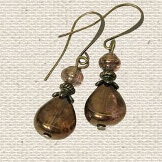 Bronze translucent Czech glass teardrop beads and shell shaped beaded earrings. Beautiful natural earthy tones and depth of color. Great teardrop earrings for everyday wear or for dress up, for the office or a night on the town.  These handmade minimalist dangle earrings are a versatile accessory and will look great with all your neutral clothing as well as any shade of brown clothing and compliment many other colors. I love browns with turquoise, red, coral, orange and more! Custom ear wire sty Copper Beaded Teardrop Earrings For Gifts, Teardrop Copper Beaded Earrings For Gift, Brown Teardrop Czech Glass Jewelry, Brown Czech Glass Teardrop Jewelry, Elegant Copper Teardrop Earrings, Brown Czech Glass Teardrop Earrings, Brown Teardrop Earrings With Ear Wire, Beaded Czech Glass Teardrop Earrings, Handmade Teardrop Copper Earrings