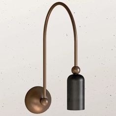 an image of a modern light fixture hanging on the wall with two balls attached to it