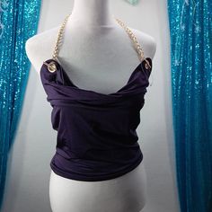 Elevate Your Party Style With This Stunning And Sexy Tube Top From Thirty Thirty. The Cowl Neck With Gold Chain Strap Adds A Touch Of Sophistication To This Purple Top, Which Is Perfect For Summer And Spring. The Lightweight And Stretchy Fabric Made From Polyester And Spandex Ensures A Comfortable Fit And Easy Movement While You Dance The Night Away At The Club. This Top Is Perfect To Wear For Any Party Or Cocktail Event And Can Be Paired With Your Favorite High-Waisted Skirt Or Jeans. The Sleev Cocktail Event, Party Style, Purple Top, The Club, Party Fashion, Stretchy Fabric, Tube Top, Chain Strap, Cowl Neck