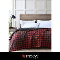 a red and black plaid comforter on a bed