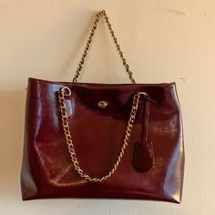 Used 3 Times. Looks Brand New. Burgundy/Maroon Color With Gold Hardware And Chain. Classic Bag With Chain Strap And Double Handle, Formal Tote Shoulder Bag With Chain Strap, Burgundy Satchel With Gold-tone Hardware For Everyday Use, Shopping Satchel With Chain Strap, Classic Bags With Chain Strap For Shopping, Daily Use Burgundy Satchel With Gold-tone Hardware, Burgundy Leather Shoulder Bag With Metal Hardware, Classic Satchel With Chain Strap For Daily Use, Everyday Satchel With Chain Strap Tote