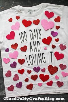 a t - shirt that says 100 days and loving it with lots of hearts on it