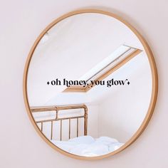 a round mirror with the words oh honey you glow on it