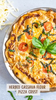 a pizza sitting on top of a metal pan covered in cheese and veggies