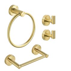 an image of a bathroom set with gold fixtures on a white background, including the toilet paper holder and towel ring