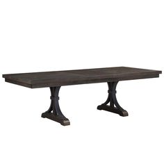 the rectangular dining table is made from dark wood and has two metal legs on each end