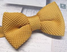 "Beautiful knit pre tied and adjustable double tiered banded bow tie. Will adjust from 13\" through 20\" neck. Bow dimensions 2.5\" x 4.5\"." Knitted Bow Tie, Classic Adjustable Bow Tie With Ribbon, Classic Adjustable Bow Tie, Yellow Fitted Bow Tie For Formal Occasions, Classic Adjustable Bow Tie With Ribbon Detail, Adjustable Gold Bow Tie And Accessories, Classic Adjustable Gold Bow Tie, Formal Fitted Yellow Bow Tie, Formal Yellow Fitted Bow Tie