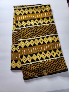 DESCRIPTION African Ankara Fabric. This is high quality African print is 100% cotton and it's 45 inches wide. It is used for making African Clothing, African quilts, & For Home decoration. FYI: Print is Double sided. The listing is for 6yards Each piece of fabric measures: 210-216in by 45in for 6yards If you purchase more than one yard, you will receive one continuous piece. *If you require more than what I have listed, feel free to send me email. CARE INSTRUCTIONS:•DO NOT BLEACH•Hand wash with Traditional Patterned Cotton Fabric For Festivals, Yellow Traditional Cotton Fabric, Traditional Cotton Batik Print Digital Prints, Traditional Yellow Cotton Fabric, Traditional Batik Print Patterned Cotton Fabric, Traditional Fabric With Patterned Batik Print, Yellow Cotton Fabric With Traditional Patterns, Traditional Cotton Batik Print, Traditional Brown Cotton Fabric