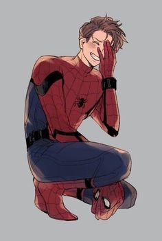 spider - man sitting on the ground with his hands to his face