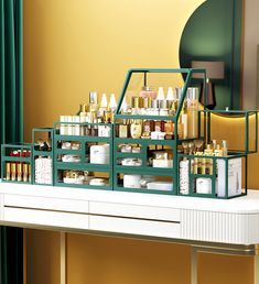 an assortment of beauty products are displayed on a shelf in front of a green curtain