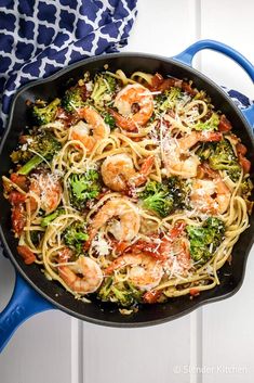 pasta with shrimp and broccoli in a skillet