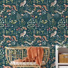 an animal themed wallpaper with deers, plants and other things on the wall