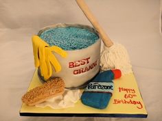 a birthday cake made to look like a bucket and broom