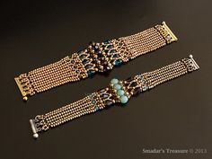 two gold bracelets with turquoise beads and chains on a black surface, one in the foreground