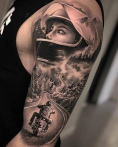 a man with a motorcycle helmet on his arm