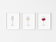 three framed art prints with wine glasses on them