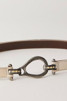 The perfect piece to pair with absolutely every outfit, this wear-anywhere belt is featured in a luxe leather fabrication with western-inspired buckle for an added timeless touch. **Features:** Fixed length, hook closure, contrast stitching, leather fabrication **Why We ❤ It:** Add effortless edge to every look with this versatile, vintage-inspired belt. | Casanova Leather Belt by Free People in Tan, Size: M/L Chic Leather Belt Buckles With Antique Buckle, Chic Leather Belt Buckle With Antique Detail, Chic Leather Belt Buckle With Antique Design, Leather Belts With Antique Buckle For Rodeo, Western Belts With Belt Loops For Everyday Use, Adjustable Western Belt Buckles For Everyday Use, Stitching Leather, Boho Clothing, Leather Belt