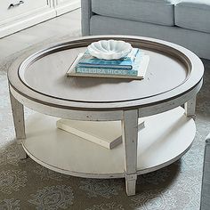 a coffee table with a book on top