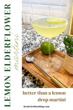 a lemon drop martini on a wooden tray