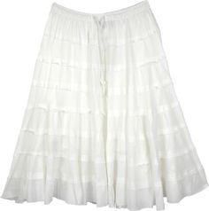 A solid white cotton skirt for summers with tiers in unfinished hem and a flouncy hemline. This short skirt is made from soft and comfortable cotton fabric and makes an ideal outfit for hot and humid weather. #tlb #JuniorPetite #TieredSkirt #vacationclothing #beachwrap #Solid #solidwhiteskirt #longcottonskirt #tieredbohoskirt White Skirt With Layered Hem, White Flowy Skirt With Layered Hem, White Long Skirt With Ruffle Hem, White Cotton Bottoms With Ruffle Hem, Casual Cotton Skirt With Layered Hem, White Ruffle Hem Skirt For Summer, Cotton Flowy Skirt With Layered Hem, Flowy Tiered White Skirt, Flowy Cotton Skirt With Layered Hem