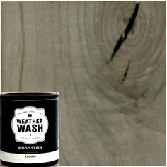 a can of weather wash wood stain sitting on top of a wooden floor next to a white wall