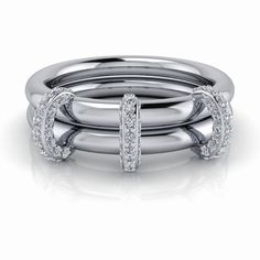 The Connected Stacking Rings, Link Stacker No. 16 features two plain bands connected with lovely diamond connectors, creating a stunning and elegant look. The connected rings allow for a comfortable and secure fit, making it perfect for everyday wear. Connected Rings: (2) Plain Bands, 2.5mm round. (3) Fixed Connector (does not go under bands), round lab grown diamonds, GH Color, SI1 Clarity, .25 ct. .25 carat total weight. Connected Rings Sizing, Order your normal size. *The ring is custom made White Gold Double Band Stackable Rings For Formal Events, Formal White Gold Double Band Stackable Rings, Elegant Double Band Diamond Stackable Rings, Elegant White Gold Stackable Double Band Rings, Modern Double Band Diamond Ring, Elegant White Gold Diamond Ring With Double Band, Elegant White Gold Double Band Diamond Ring, Classic Double Band White Gold Diamond Ring, Classic White Gold Diamond Ring With Double Band