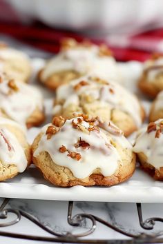 a white plate topped with cookies covered in frosting