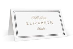 a white card with gold foil lettering on the front and bottom, which reads table name elizabeth