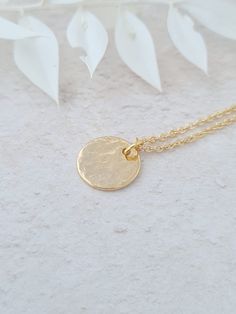 Minimalist gold plated hand hammered coin necklace. This can be worn on its own or layered. The disc is gold plated and the fine chain is gold plated. The disc measures 12mm in diameter. This item ships from the UK within 1 working day. Please note that this necklace is gold plated, therefore it must be taken off before showering, swimming, going to the gym or before applying body lotion etc. Gold Coin, Layering Necklace, Coin Necklace, Coin Pendant, Minimalist Necklace, Gold Coins, Bridesmaid Gift, Layered Necklaces, Girl Gifts