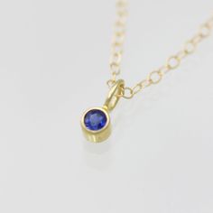 Very classy, simple, and dainty. This handcrafted gold pendant has a natural round, faceted Sapphire stone. It can also be paired with other pendants! Mix and match to create your own personalized necklace or mother necklace! Gold is 14ky. Stone measures 3mm in diameter. Birthstone for September. Comes in your choice of AA or AAA grade. Please make your selection when adding this item to your cart. Comes with a lifetime warranty, care card, polishing cloth, and gift box. This item is sold as the Minimalist 14k Gold Birthstone Necklace With Bezel Setting, Dainty Yellow Gold Birthstone Necklace With Round Stone, Everyday Yellow Gold Birthstone Necklace With Round Pendant, Everyday 14k Gold Round Pendant Birthstone Necklace, Everyday Yellow Gold Birthstone Necklace, Dainty 14k Gold Birthstone Necklace With Round Pendant, Everyday 14k Gold Birthstone Necklace, Gold Faceted Birthstone Necklace In 14k Gold, 14k Yellow Gold Faceted Birthstone Necklace