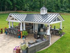 an outdoor kitchen and dining area is shown from above